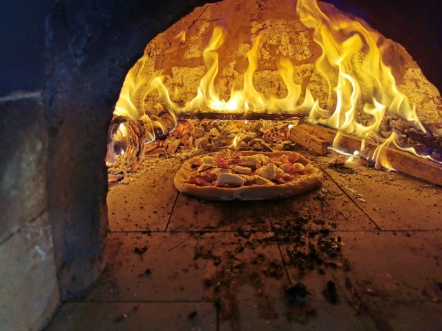 cooking a pie in the cob oven